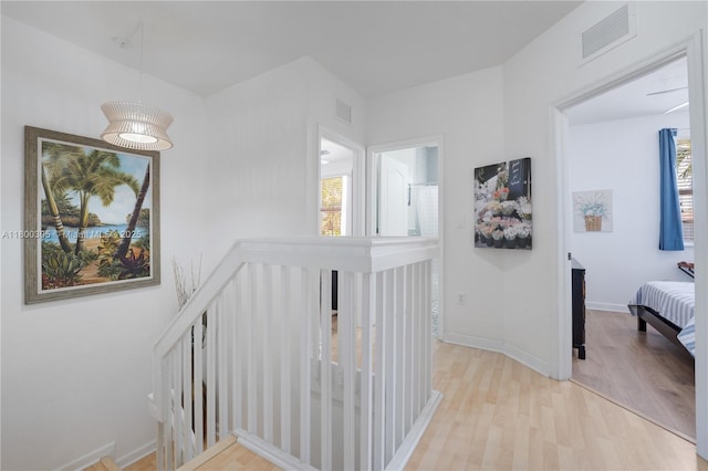 11324 NW 74th Ter, Doral, FL 33178 - hall featuring an upstairs landing, wood finished floors, and baseboards