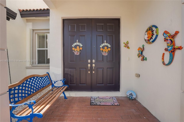 11324 NW 74th Ter, Doral, FL 33178 - property entrance with stucco siding and a tiled roof