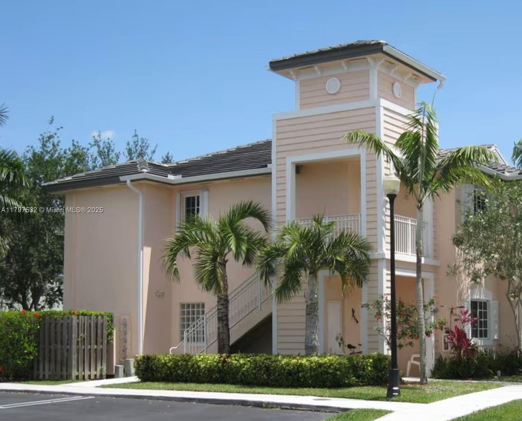 383 NE 27th Ter Unit 206, Homestead, FL 33033 - view of building exterior featuring uncovered parking