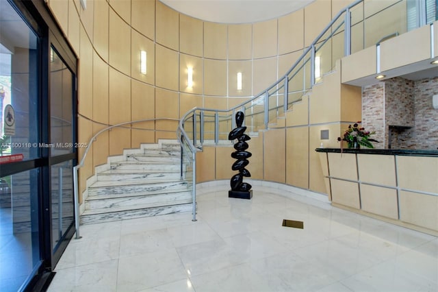 6770 Indian Creek Dr Unit 6O, Miami Beach, FL 33141 - stairway featuring a high ceiling