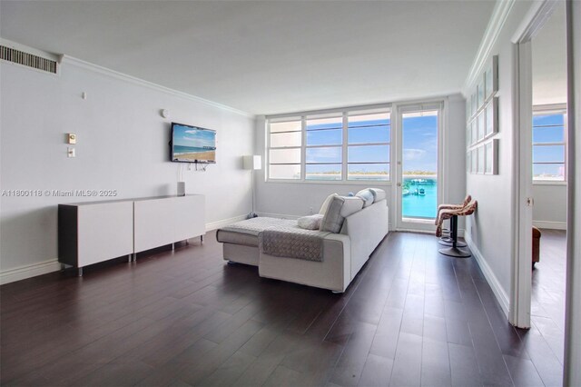 6770 Indian Creek Dr Unit 6O, Miami Beach, FL 33141 - living area with ornamental molding, dark wood-style flooring, plenty of natural light, and baseboards