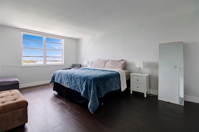 6770 Indian Creek Dr Unit 6O, Miami Beach, FL 33141 - bedroom with dark wood-style floors and baseboards