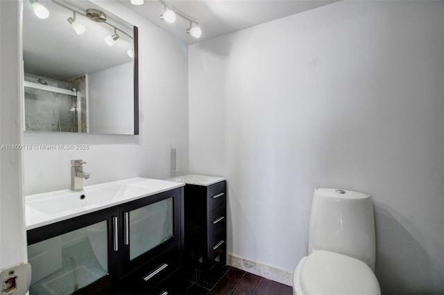 6770 Indian Creek Dr Unit 6O, Miami Beach, FL 33141 - full bath featuring vanity, a stall shower, wood finished floors, toilet, and baseboards