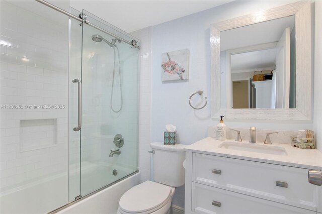 825 Center St Unit 24A, Jupiter, FL 33458 - bathroom with vanity, toilet, and bath / shower combo with glass door