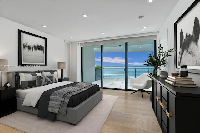1930 Bay Dr Unit Ph-1, Miami Beach, FL 33141 - bedroom featuring access to outside, floor to ceiling windows, and light wood-style flooring
