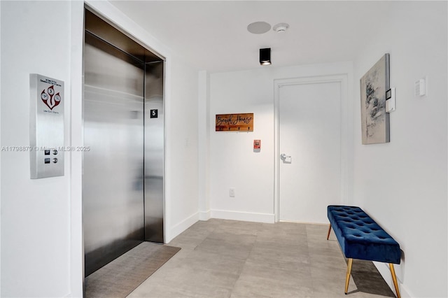 1930 Bay Dr Unit Ph-1, Miami Beach, FL 33141 - hall with elevator, baseboards, and concrete flooring