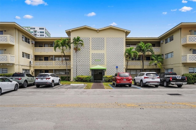 11930 NE 19th Dr Unit 15, North Miami, FL 33181 - view of apartment building / complex featuring uncovered parking