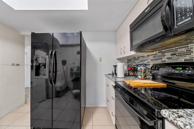 11930 NE 19th Dr Unit 15, North Miami, FL 33181 - kitchen with black appliances, decorative backsplash, light stone counters, and white cabinets