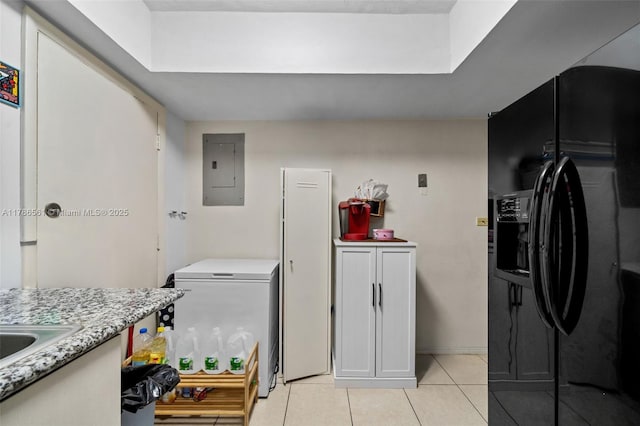 11930 NE 19th Dr Unit 15, North Miami, FL 33181 - laundry area featuring electric panel, light tile patterned floors, and cabinet space