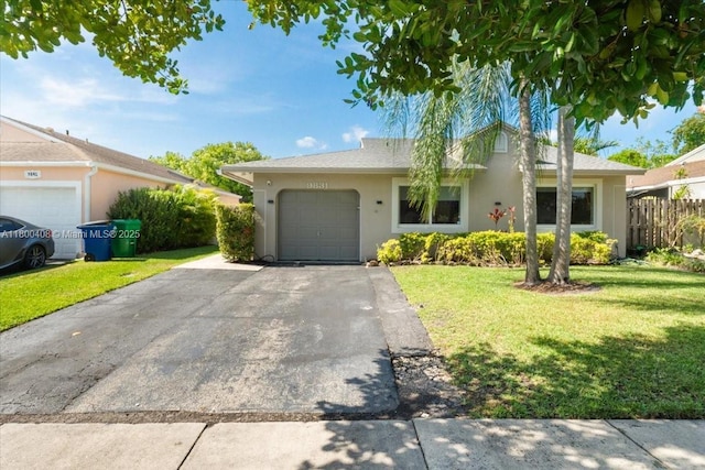 9831 SW 58th Ct, Cooper City, FL 33328 - view of front of property with driveway, stucco siding, and an attached garage