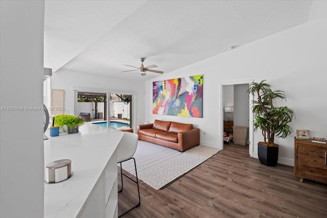 9831 SW 58th Ct, Cooper City, FL 33328 - living room featuring ceiling fan, wood finished floors, baseboards, a textured ceiling, and vaulted ceiling
