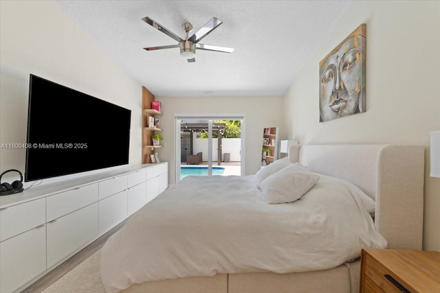 9831 SW 58th Ct, Cooper City, FL 33328 - bedroom with access to outside, a ceiling fan, and a textured ceiling