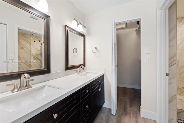 9831 SW 58th Ct, Cooper City, FL 33328 - bathroom featuring wood finished floors and double vanity