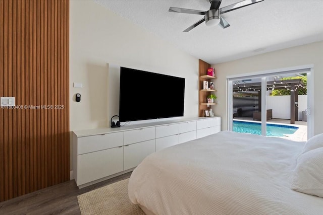9831 SW 58th Ct, Cooper City, FL 33328 - bedroom featuring access to exterior, wood finished floors, and a ceiling fan