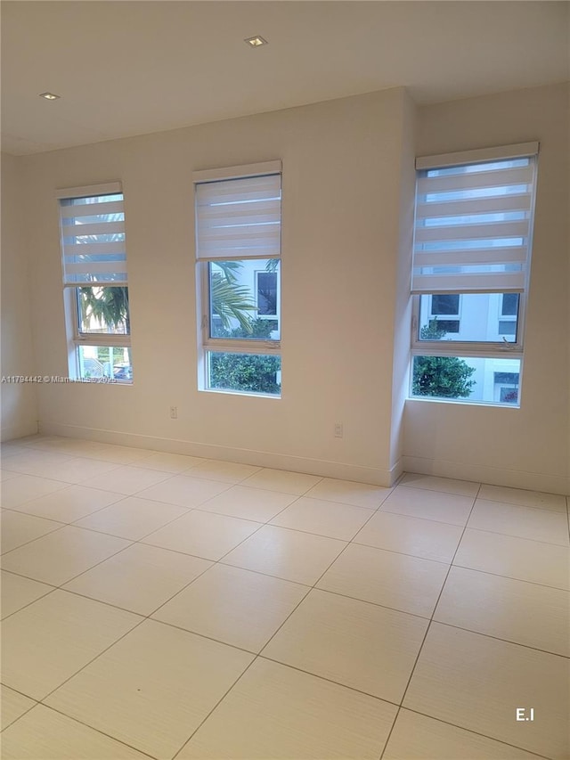 9133 NW 33rd St, Doral, FL 33172 - unfurnished room featuring light tile patterned flooring and baseboards