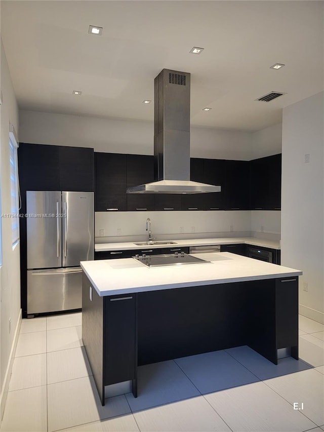 9133 NW 33rd St, Doral, FL 33172 - kitchen featuring freestanding refrigerator, island exhaust hood, dark cabinetry, modern cabinets, and light countertops