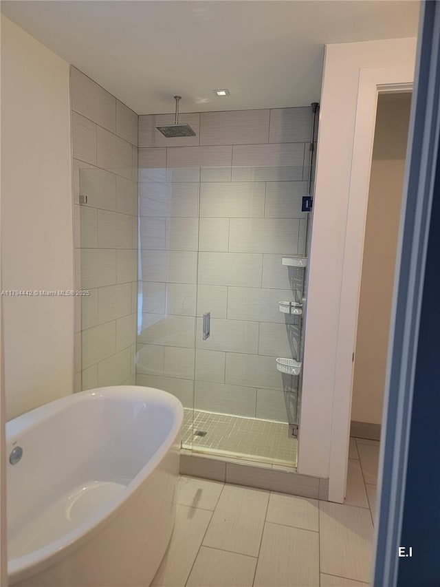 9133 NW 33rd St, Doral, FL 33172 - full bath with tile patterned floors, a stall shower, and a freestanding tub