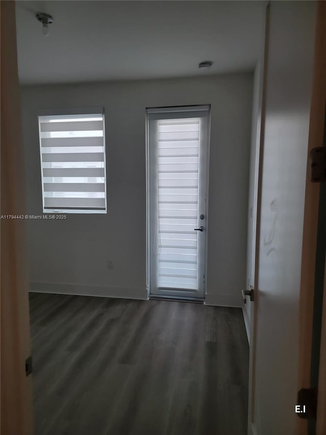 9133 NW 33rd St, Doral, FL 33172 - doorway with wood finished floors and baseboards