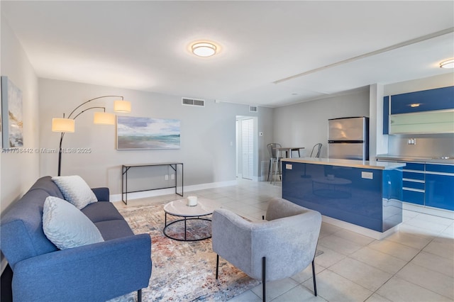 301 Jefferson Ave Unit 4D, Miami Beach, FL 33139 - living area featuring light tile patterned floors and baseboards