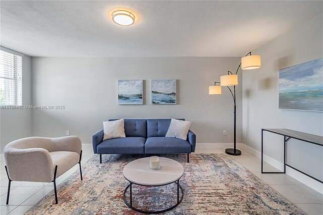 301 Jefferson Ave Unit 4D, Miami Beach, FL 33139 - tiled living room featuring baseboards