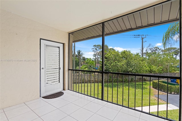 unfurnished sunroom featuring healthy amount of natural light