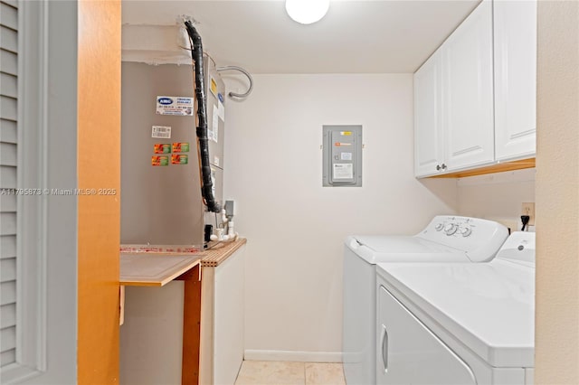 laundry room featuring cabinet space, electric panel, washer and clothes dryer, baseboards, and light tile patterned flooring