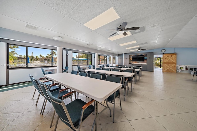322 Pine Ridge Cir Unit A-2, Green Acres, FL 33463 - dining space featuring a ceiling fan, lofted ceiling, and light tile patterned floors