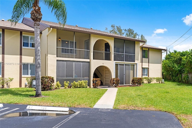 322 Pine Ridge Cir Unit A-2, Green Acres, FL 33463 - view of property with uncovered parking