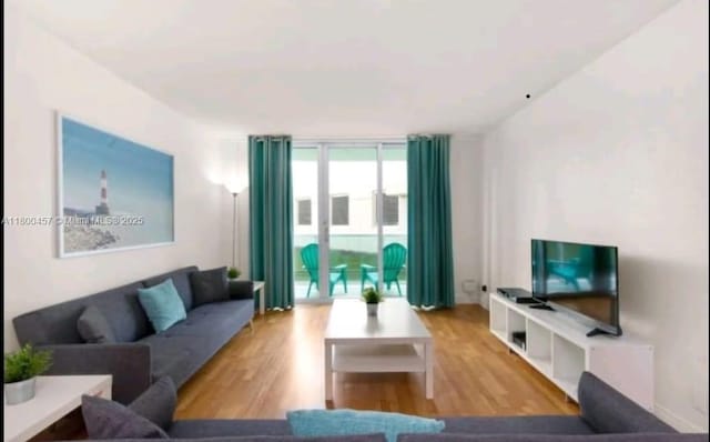 3901 S Ocean Dr Unit 2Z, Hollywood, FL 33019 - living area with wood finished floors and a wall of windows