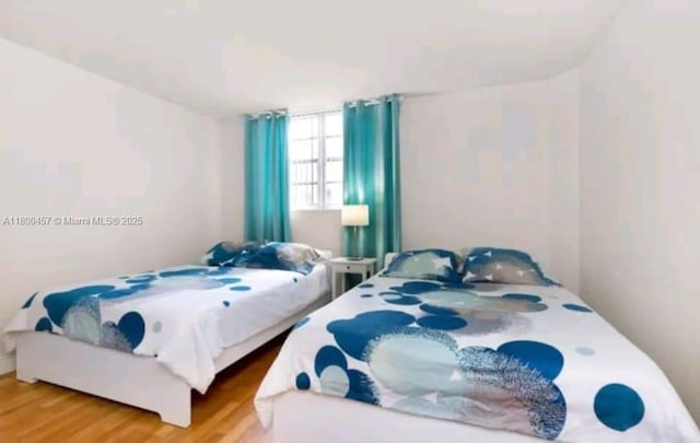 3901 S Ocean Dr Unit 2Z, Hollywood, FL 33019 - bedroom featuring wood finished floors