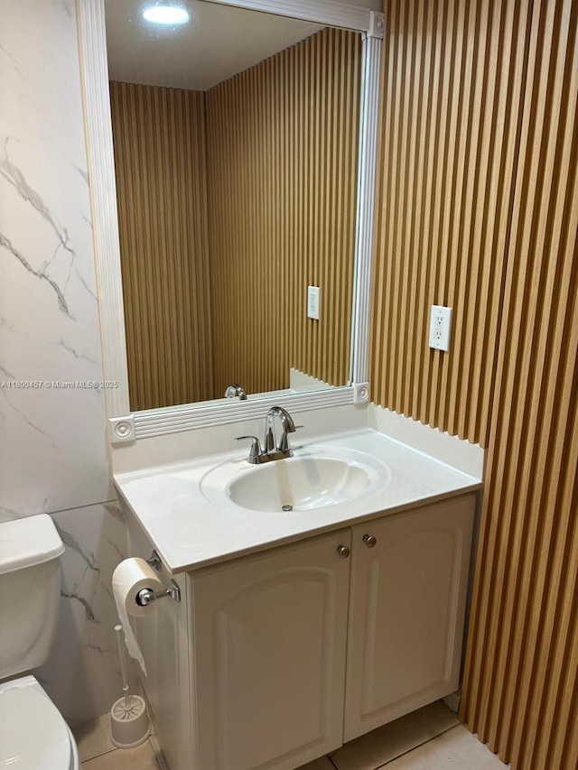3901 S Ocean Dr Unit 2Z, Hollywood, FL 33019 - half bath featuring wallpapered walls, toilet, and vanity