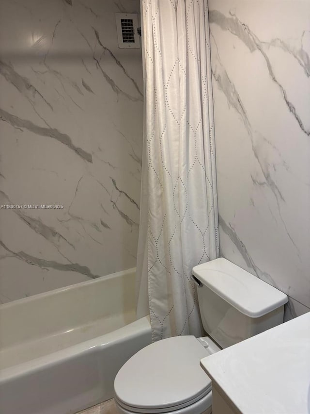 3901 S Ocean Dr Unit 2Z, Hollywood, FL 33019 - bathroom featuring vanity, shower / bathtub combination with curtain, and toilet