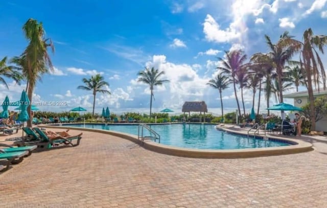 3901 S Ocean Dr Unit 2Z, Hollywood, FL 33019 - community pool featuring a patio