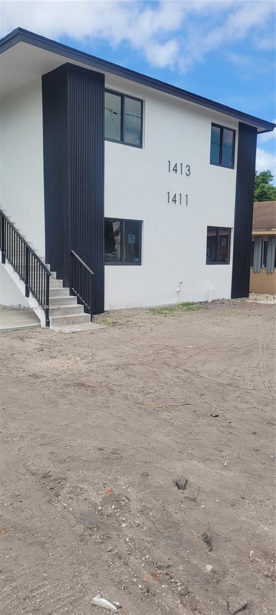 1411 NW 40th St, Miami, FL 33142 - view of home's exterior featuring stucco siding