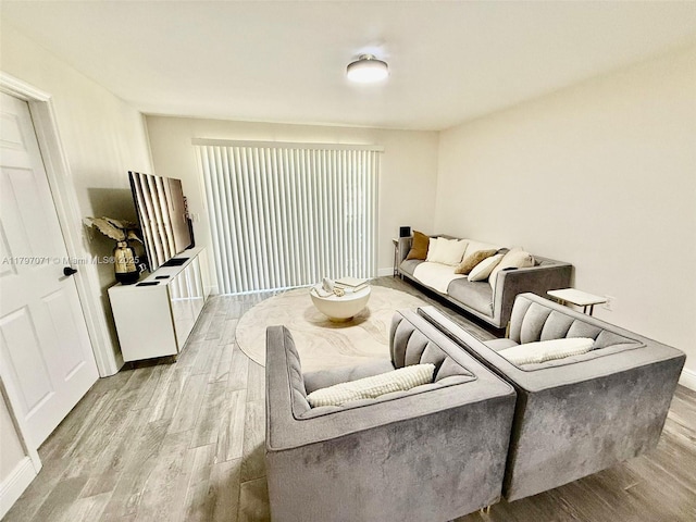 300 Promenade Dr Unit 105, Dunedin, FL 34698 - living room with light wood-type flooring and baseboards