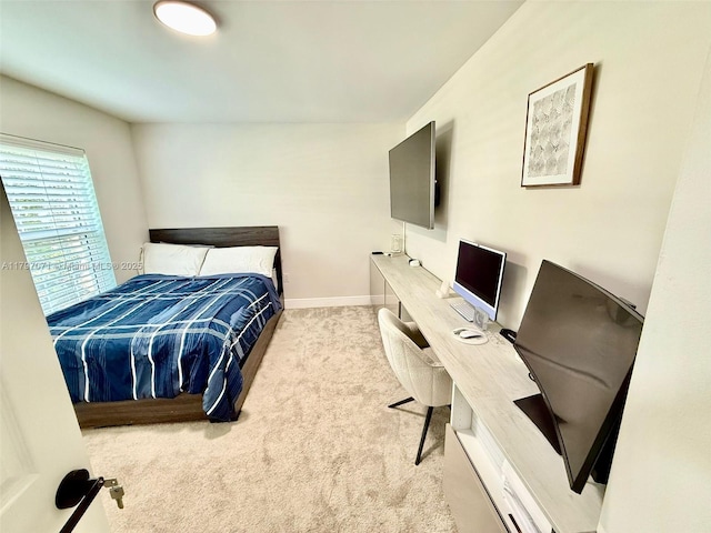 300 Promenade Dr Unit 105, Dunedin, FL 34698 - carpeted bedroom with a desk and baseboards