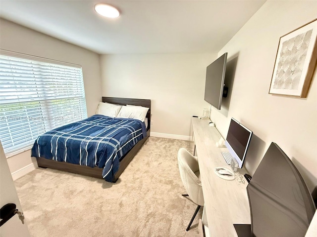 300 Promenade Dr Unit 105, Dunedin, FL 34698 - bedroom with carpet flooring and baseboards