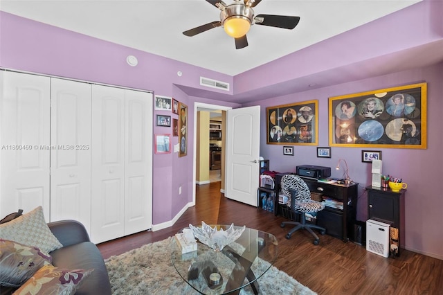 office area with wood finished floors, baseboards, and ceiling fan