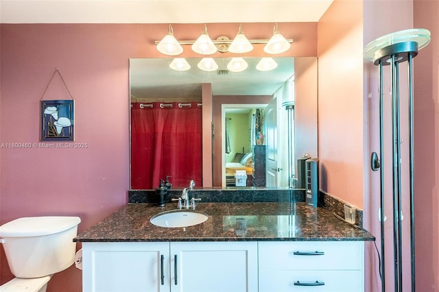 full bath with vanity and toilet