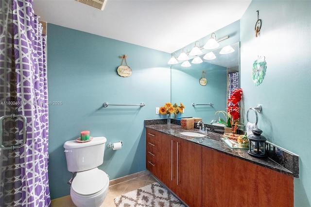 full bath with tile patterned floors, vanity, toilet, and curtained shower