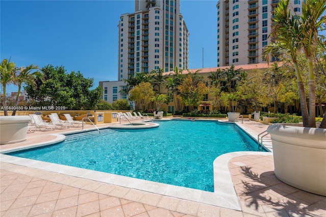 community pool featuring a patio area