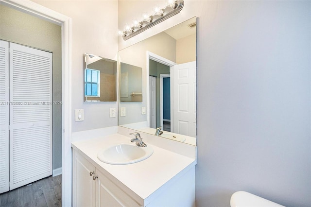 2933 SE 2nd St Unit 20, Homestead, FL 33033 - bathroom featuring toilet, vanity, and wood finished floors