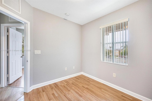 2933 SE 2nd St Unit 20, Homestead, FL 33033 - empty room featuring light wood-style flooring, baseboards, and a smoke detector