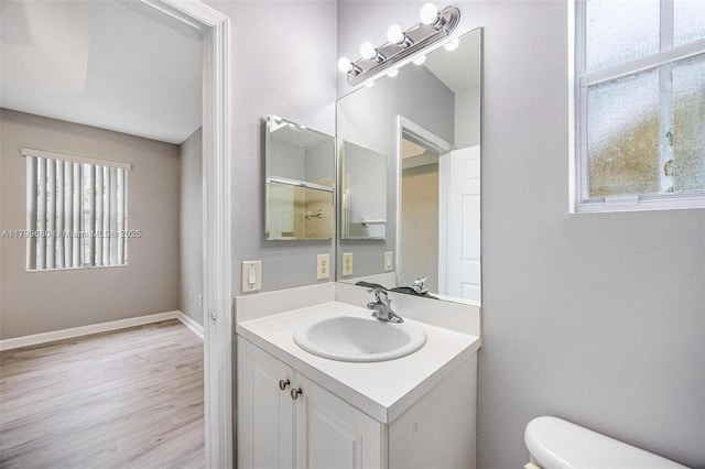 2933 SE 2nd St Unit 20, Homestead, FL 33033 - bathroom with plenty of natural light, toilet, wood finished floors, and vanity