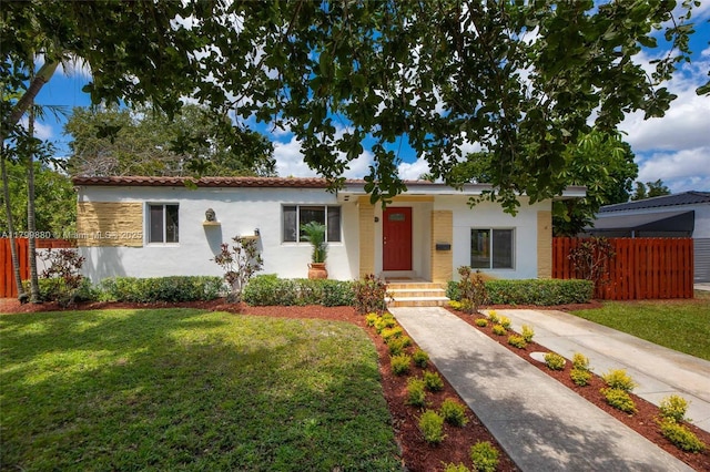12000 NE 11th Ct, Biscayne Park, FL 33161 - view of front of property with stucco siding and a tiled roof