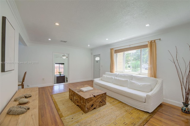 12000 NE 11th Ct, Biscayne Park, FL 33161 - living room with wood finished floors, recessed lighting, crown molding, baseboards, and ceiling fan