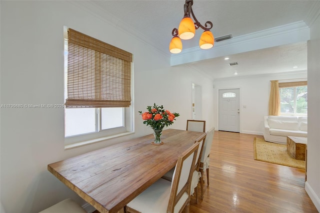 12000 NE 11th Ct, Biscayne Park, FL 33161 - dining space featuring wood finished floors, crown molding, baseboards, and recessed lighting