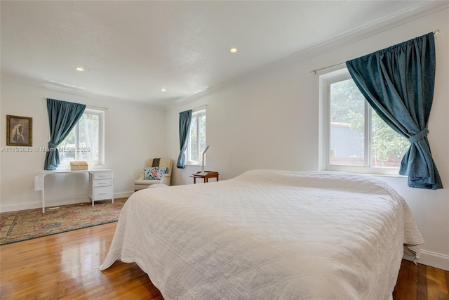 12000 NE 11th Ct, Biscayne Park, FL 33161 - bedroom with crown molding, multiple windows, wood finished floors, baseboards, and recessed lighting