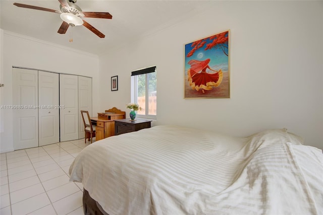 12000 NE 11th Ct, Biscayne Park, FL 33161 - bedroom featuring ornamental molding, light tile patterned floors, ceiling fan, and a closet