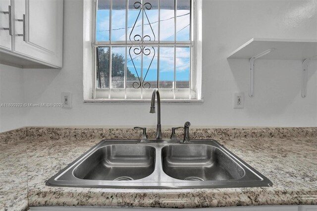 3051 NW 77th St, Miami, FL 33147 - kitchen view of a sink and white cabinetry